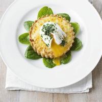 Smoked haddock tartlets with poached eggs & chives image