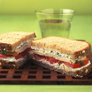 Turkey Sandwich With Herbed Farmer Cheese, Sprouts, and Tomato image