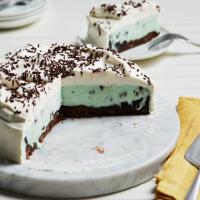 Mint Chocolate Chip Ice Cream Cake with Brownie Crust and Vanilla Whipped Cream Frosting image