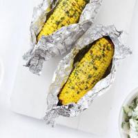 Buttery baked corn on the cob image