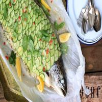 Whole baked salmon stuffed with lemon and herb rice_image