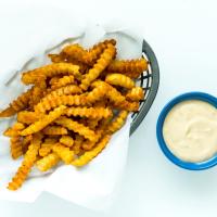 Try These 76ers-Inspired Crab Fries with Cheese Sauce_image