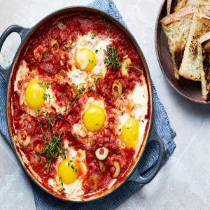 Baked Eggs in Tomato-Pimento Olive Sauce image