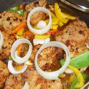 Pork Chops Garnished With Peppers & Onions_image