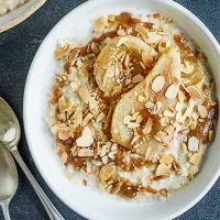 Vanilla poached pears with almond butter porridge topping image