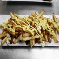 Curry Fries with Bacon and Feta image