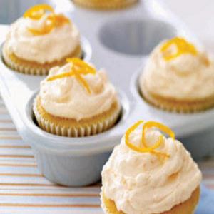 CREAMSICLE CUPCAKE WITH ORANGE BUTTERCREAM FROSTING_image