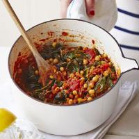 Chana masala (chickpea curry) with spinach image