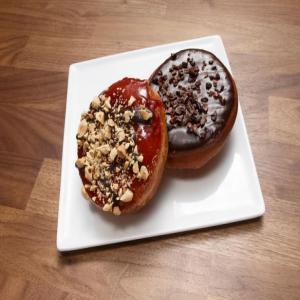 Peanut Butter with Jelly Glazed Doughnuts Topped with Chopped Salted Peanuts image