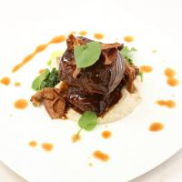 Tamarind-Braised Short Ribs with Truffle Sunchoke Purée, Watercress Purée, and Glazed Chanterelle Mushrooms image