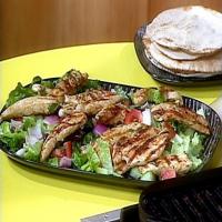 Greek Grilled Chicken and Vegetable Salad with Warm Pita Bread for Wrapping image