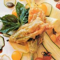 Cheese-Stuffed Squash Blossoms with Shaved Baby Squash and Toasted Pumpkin Seeds image