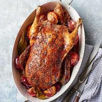Roast spiced duck with plums image