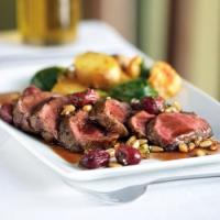 Grilled Lamb with Curried Vegetables and Grape Pine Nut Gremolata image