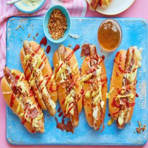 Cheesy hot dogs with pickle mustard sauce & crispy onions image