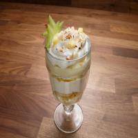 Coconut Custard Trifle with Vanilla Bean Whipped Cream and Tropical Fruit with Macadamia Nuts_image