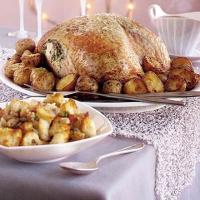Herb-buttered turkey, roasties & cranberry sauce gravy image