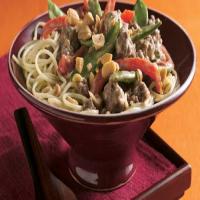 Thai Peanut Beef and Pea Pods Over Noodles image
