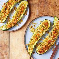 Stuffed baked courgettes with garlic & herb crumbs & pine nuts image
