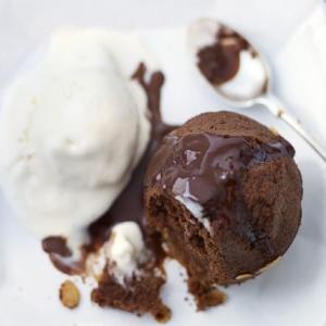 Chocolate & almond puds with boozy hot chocolate sauce image