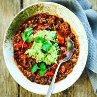 Mexican bean soup with guacamole image