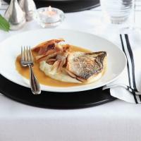 Roast fillet of sea bass with parsnip purée & caramelised garlic_image