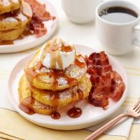 Orange Pumpkin Pancakes with Vanilla Whipped Cream, Cinnamon Maple Syrup and Thick-Cut Bacon image