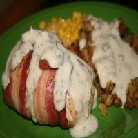 Stuffed Chicken Wrapped in Bacon Served With Gravy image