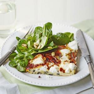 Slice of frittata with nutty green salad & balsamic dressing image