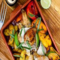 Spice-Rubbed Beer-Can Chicken with Potatoes and Sweet Peppers image