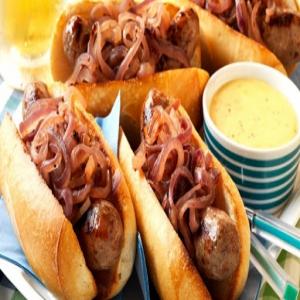 BEER-SIMMERED BRATS WITH CHEESE SAUCE Recipe - (4.4/5) image