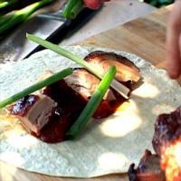 Rotisserie Duck with Hoisin Baste served with Grilled Oranges, Scallions and Pancakes_image