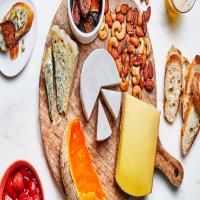 Cheese Board with Roasted Strawberries, Garlic & Herb Nuts, and Honey & Orange Roasted Figs_image