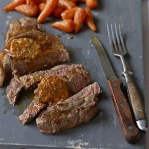 Sirloin with spiced butter, shallot salad, roasted carrots & mash image