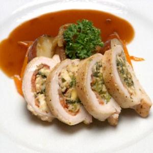 Chicken Stuffed with Smoked Mozzarella, Roasted Tomatoes and Broccoli Rabe over Potatoes with Marsala Sauce image