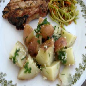 Baby red potatoes with garlic and parsley image