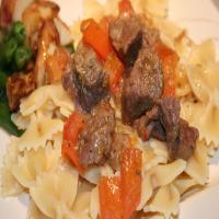 Rosemary Beef and Tomato over Noodles image