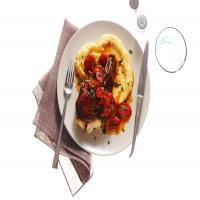 Mozzarella-Stuffed Pork Chops with Polenta and Tomatoes image
