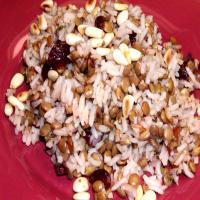 Rice, Lentils and Dried Cranberries Garnished With Pine Nuts_image