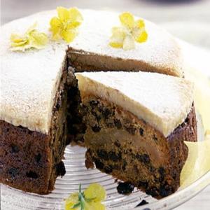 Ginger simnel cake with spring flowers image