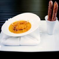Spiced Pumpkin Creme Brulee With Ginger-Dusted Churros image
