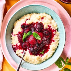 Millet porridge with almond milk & berry compote image