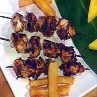 Bob Marley's Reggae: Jerk Marinated Chicken Breast Skewers, Chargrilled and Served with Creamy Cucumber Dipping Sauce and Yucca Fries_image