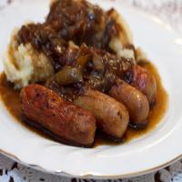 Sausages With Mashed Potatoes, Beer and Onion Gravy and Mustard image