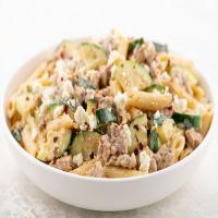 Creamy Garlic Pork Penne with Zucchini and Feta stovetop cooking_image