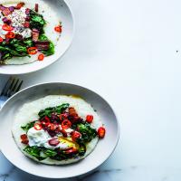Cheesy Grits With Poached Eggs, Greens, and Bacon image