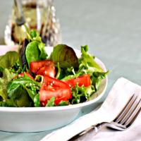 A Salad of Arugula (Rocket), Cherry Tomatoes and Sesame Seed_image