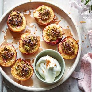 Roast pistachio-stuffed peaches with orange blossom cream_image