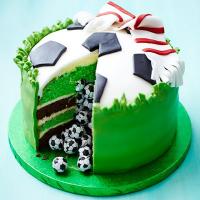 Surprise piñata football cake_image
