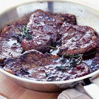Steaks in red wine sauce image